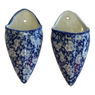 Pair of Blue and White Glazed Ceramic Floral Wall Pockets For Sale