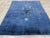 This Mid-20th century Chinese Peking Art Deco rug, is a striking example of the bold design and rich color palette...