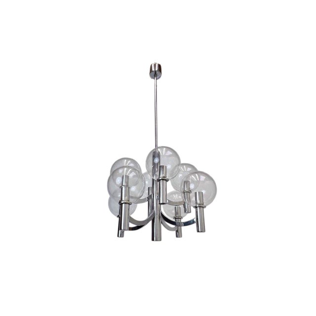 A pendant lamp from the 1960s by Kaiser Leuchten, made of shiny chrome-plated metal with 8 clear glass spheres. The lamp...