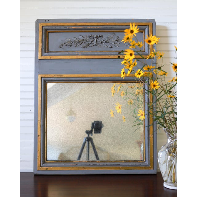 This elegant piece is an antique Trumeau style wall mirror, expertly crafted from solid pine with a painted grey finish....
