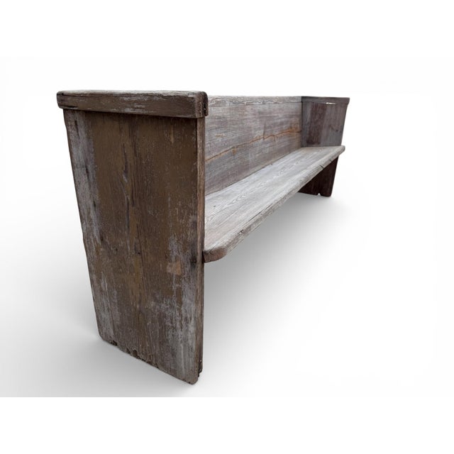 An early 20th-century farmhouse church pew bench salvaged from a rural South Carolina farm church. Hand-built from hard...