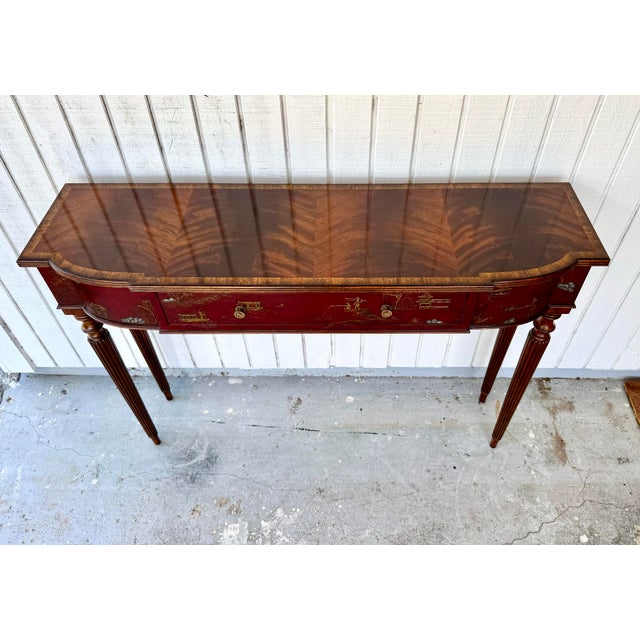 This elegant and highly decorative furniture piece blends classic design elements with fine craftsmanship .This piece is a...