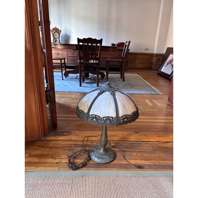 Antique arts and crafts bronze and bent panel slag glass table lamp