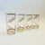 A set of 4 mid century highball tumblers. Each is decorated in metallic gold lines that spiral around the sides of the...