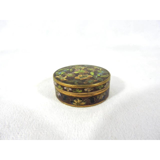 Pretty little Chinese cloisonné round pill box made in China in the 1980's. Rich autumn colours with a brown background -...