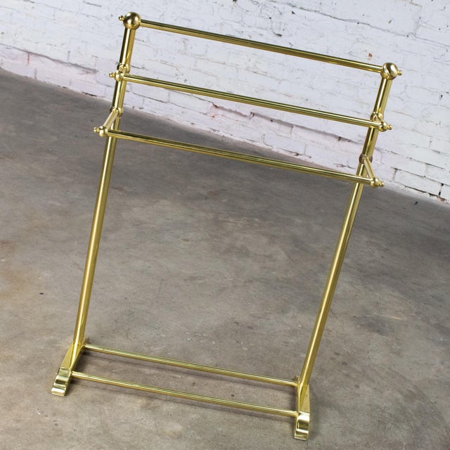 Marvelous vintage Hollywood Regency style solid brass freestanding towel stand with triple tiered hanging bars & brass...