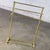 Marvelous vintage Hollywood Regency style solid brass freestanding towel stand with triple tiered hanging bars & brass...
