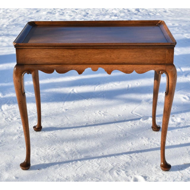 Vintage (1970's) Tea Table has a Queen Anne Style. Made by Kittinger Furniture. The Wood is Mahogany. The Finish is a...