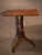 English Mahogany Late Georgian tilt top candle stand. A rectangular top with rounded corners rests on a well turned stem...