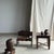 Small bench with a carved backrest featuring a stylized bird motif. A small piece of children's furniture, second-hand...