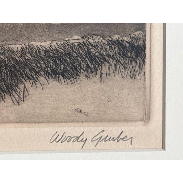 “Desolation,” an evocative limited-edition drypoint intaglio etching by American artist Woody Gruber (1946–2022). A...
