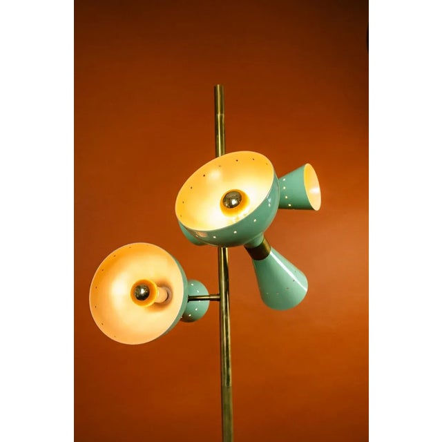 Stilnovo design floor lamp, an original from the 1960s. This lamp consists of a cylindrical brass structure and three...