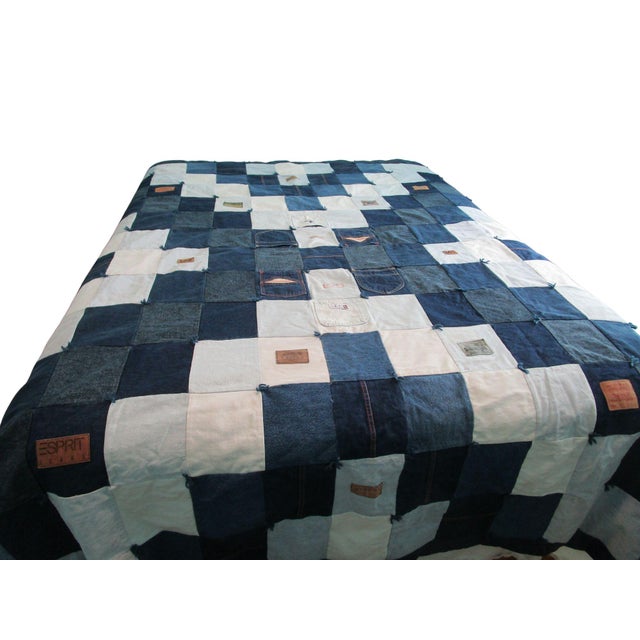 This one-of-a-kind quilt blends artistry and sustainability, featuring upcycled vintage denim squares in varying shades of...