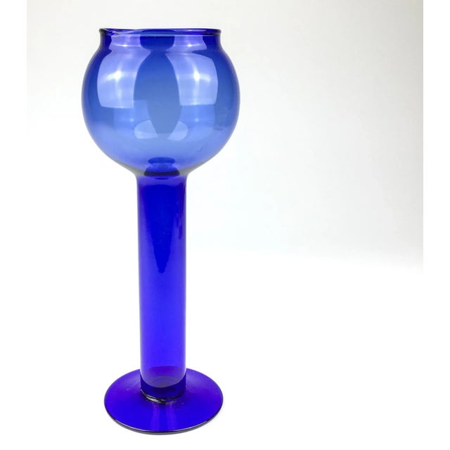 We love his piece. Such an unusual design. Use as a vase or a candleholder. Or simply sit it on the table and add that...