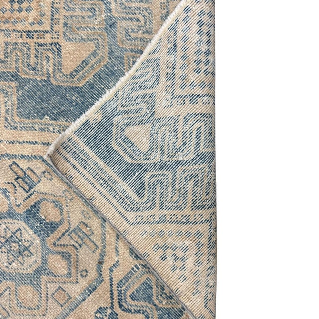 This elegant antique Persian runner is distinguished by its long, narrow proportions and beautifully restrained palette....