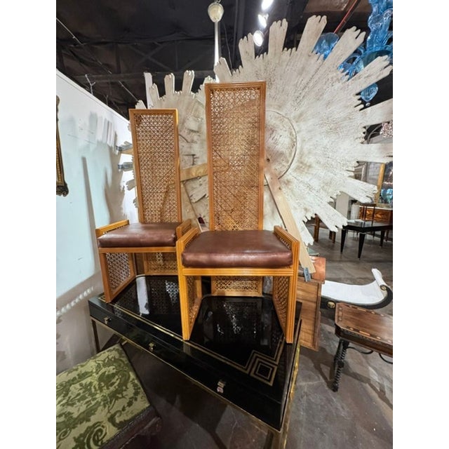 This product is a MCM pair of designer high back rattan hallway chairs. With a unique and stylish design, these chairs add...