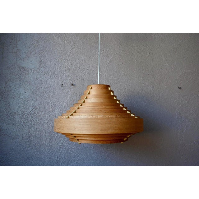 A rare and sculptural piece that will captivate lovers of Nordic design! This exceptional vintage pendant light is by...