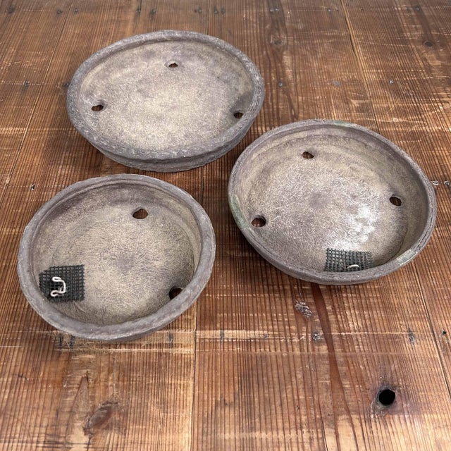 Beautiful set of round unglazed 'Tokoname Ware' bonsai pots from Japan. Dimensions: height 5 cm, 4 cm, 3.5 cm; diameter 25...