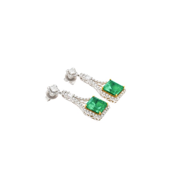 GRS Certified perfect matching pair of minor oil pastel green Colombian emeralds and diamond drop earrings. Details: ✔...