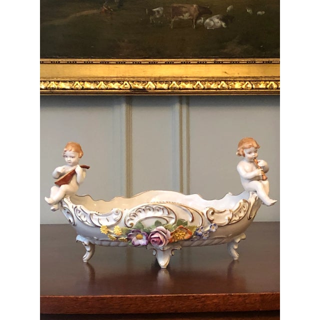 Beautiful pair of vintage German porcelain candle holders and matching footed centerpiece bowl produced in the early 20th...