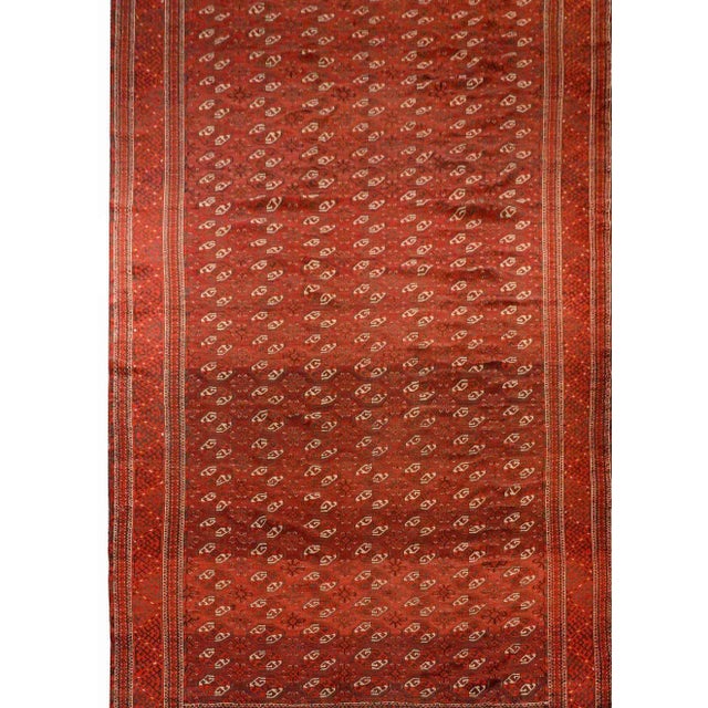 A wonderful early 20th century Persian Turkomen rug with an all-over pattern of crimson and white lozenge-shapes...
