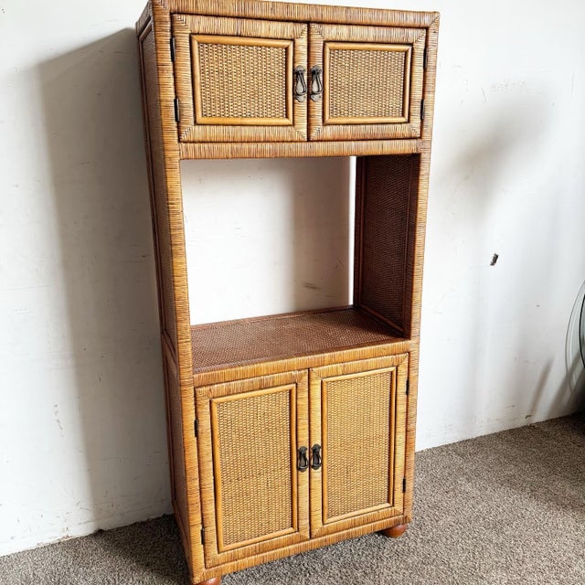 Description: Elevate your space with the rustic charm of this Boho Chic Wicker Wrapped Etagere/Cabinet. Crafted with...