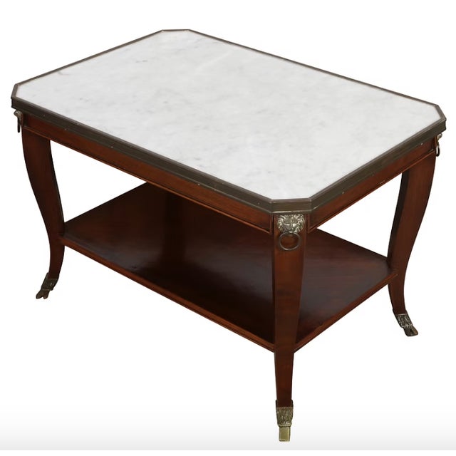 Pair of Regency-style mahogany end tables (c1950s) with a white marble top and gilt-bronze (ormolu) mounts. Neoclassical...