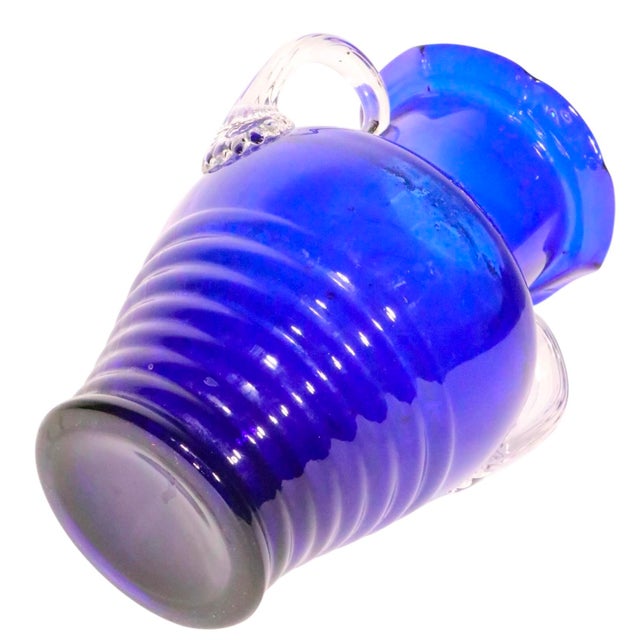 Art Deco Art Glass handled vase, attributed to the Fostoria Glass Company. The vase features a cobalt glass body with...
