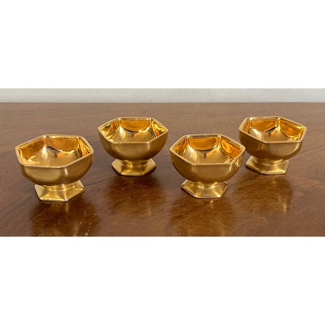Set 4 antique early 20th century German gold porcelain salt cellars. Hexagonal shape rising on a conforming foot. Marked...