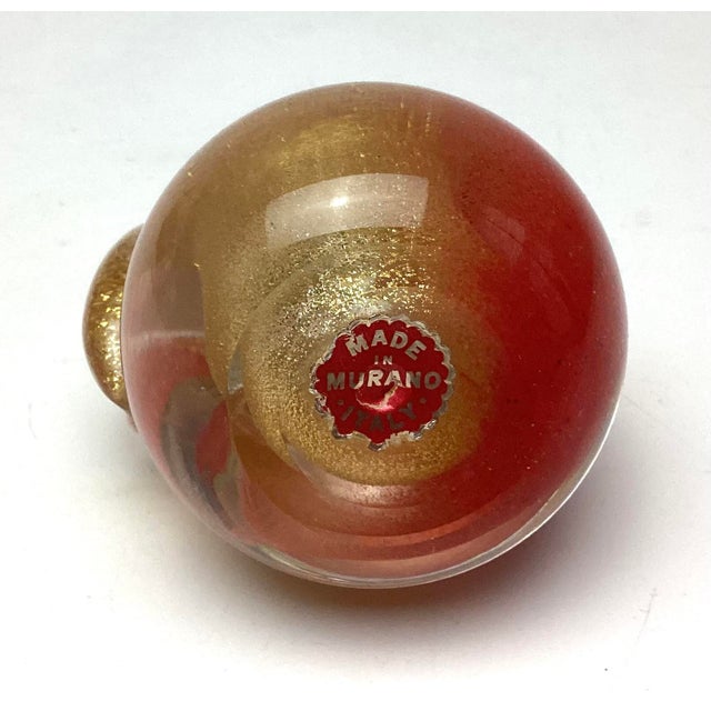 A beautifully crafted Murano glass pear, circa 1960s, standing 4” tall by 2½” in diameter. This exquisite piece shimmers...