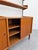 An iconic two-span modular wall unit in fine teak, dating from the 1960s. This splendid example of mid-century...