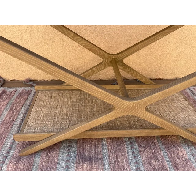 Grass cloth lining in interior and bottom shelf. Perfect for entertaining. The grey cerused ash bar cart folds into an...