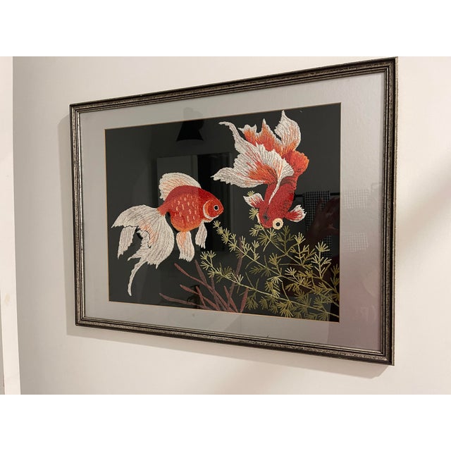 Exquisite embroidered goldfish. Vibrant contrasting colors.