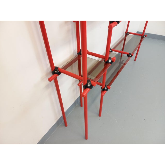 Vintage Italian Bauhaus and post-modernist bookcase from the 1970s, with a red tubular metal and black metal frame, small...