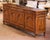 This substantial antique French oak enfilade was crafted circa 1950 in the Louis XV provincial style. Almost nine feet...