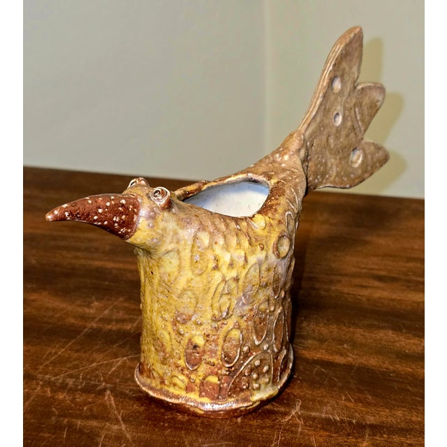 A whimsical mid‑century studio pottery bird sculpture signed Eggerman, created by the workshop associated with American...
