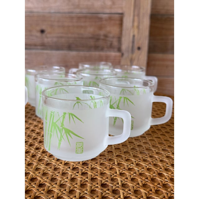 Charming set of eight vintage frosted glass mugs by Sasaki featuring a fresh lime green bamboo motif. These mid-century...