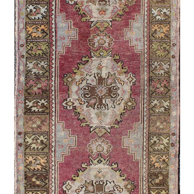 Measures: 3' x 9'3. Berry tri-medallion vintage Turkey Oushak runner with gray, camel, blush accents. Keivan Woven Arts /...