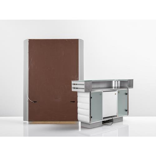 Very rare and beautiful vintage dry bar, 1970s. White leather, metal silver bars. the set includes: illuminated shelves, a...