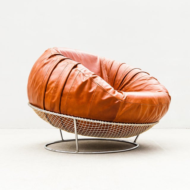 Rare and collectible MP-87 lounge chair in leather, steel, and fishing net, designed by Percival Lafer in 1971 and...