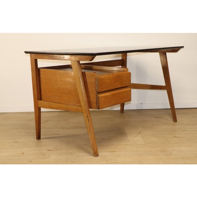 Charming vintage desk from the 1950s, with clean, balanced lines typical of furniture from that era. Its functional and...