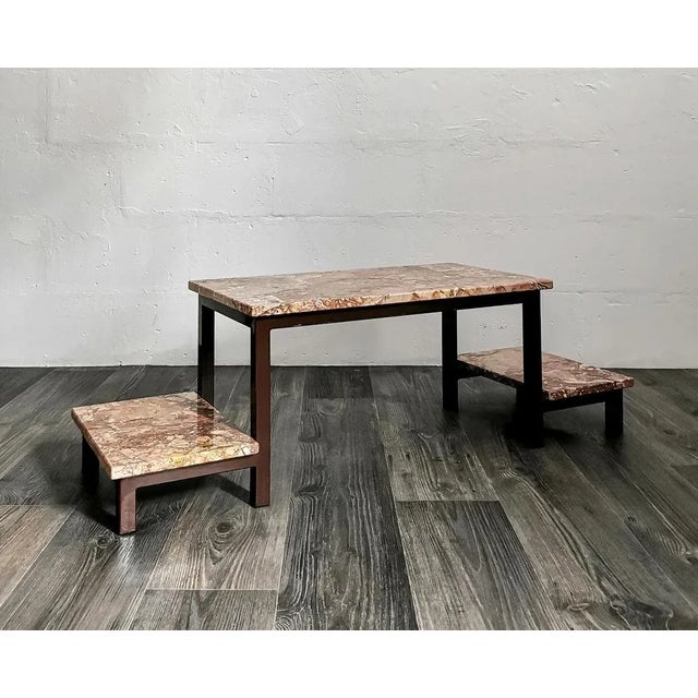 This flower pedestal with 3 levels dates from the 1960s and was made in Germany. It consists of a brown lacquered metal...