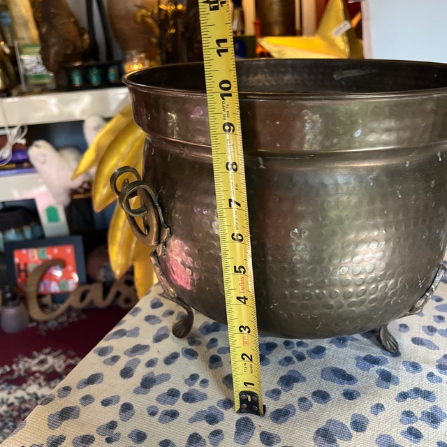 Up for consideration is a beautiful vintage hand hammered brass footed bucket planter. This would look lovely in your home...