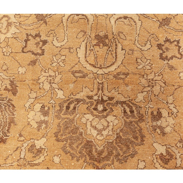 This early 20th century antique Indian Amritsar rug from Amritsar Rugs collection features an intricate all-over design of...