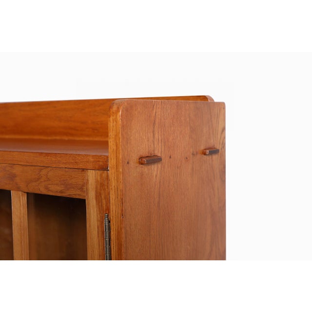 The Mission Oak 2-Door Bookcase with Glass Doors - Michael's Cherry is a beautifully crafted piece that embodies the...