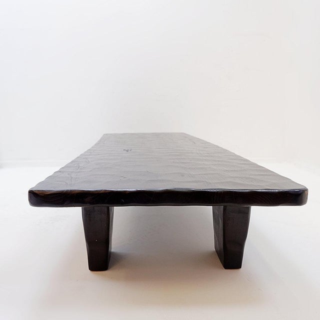 Contemporary - tribal coffee table Measures : 181x60cm H:27cm Material : Pine Wood Brutalist coffee table in black fir...