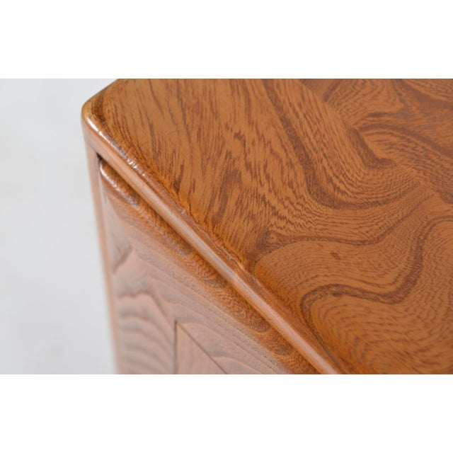 This original 1950s ercol windsor sideboard, which can also be used as a room divider, is made entirely in solid elm with...