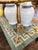 This table has three petite legs. It is painted turquoise and blue and is sturdy for its age and side.