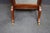 Edwardian style freestanding cheval dressing mirror crafted in mahogany with brass decorative accents and urn finials....