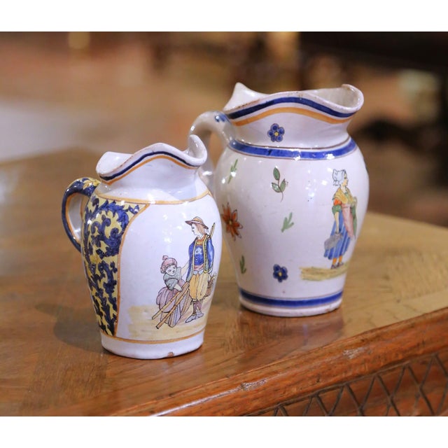 Pair of 19th Century French Quimper Faience Jugs With Breton Figures and Floral For Sale - Image 4 of 13